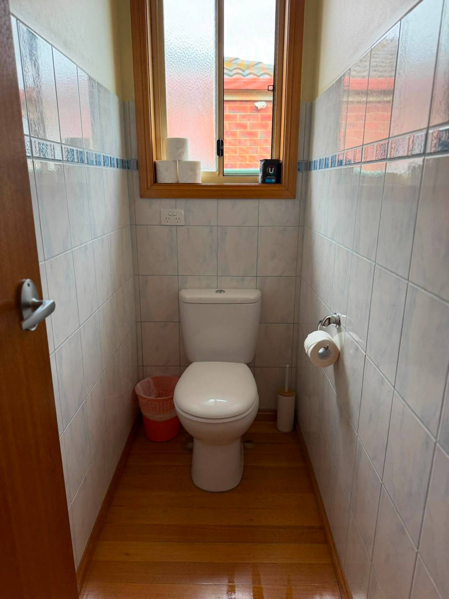 Spotless tiled toilet and bathroom after a deep clean by No.1 Cleaning